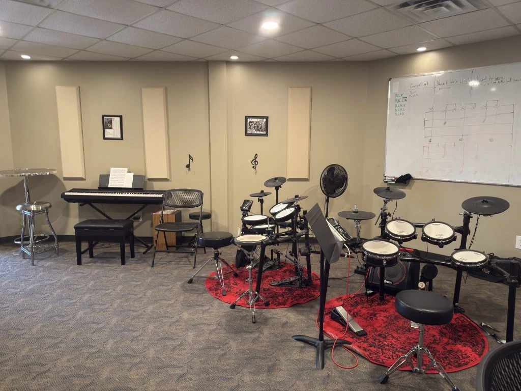 Student band and drum room at Music Lessons 1on1, a private music lesson studio in College Station, Texas.
